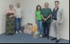 Dirigentes posam ao lado das doações à Campanha Bancário Solidário de Natal